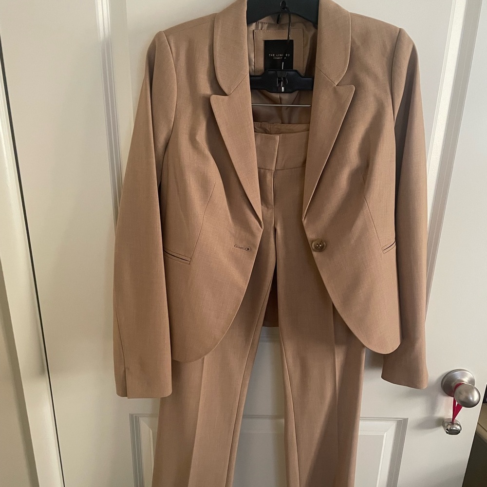 Limited Camel colored suit with front and back pockets only worn for interviews